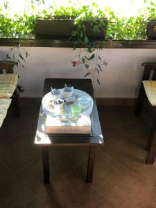 a coffee table with a book on top of it at Villa Lykos Plitvice in Plitvička Jezera