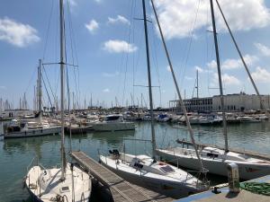 a group of boats docked in a harbor at Beach Apartment in Vilanova i la Geltrú