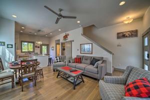 a living room with a couch and a table at Bozeman Home with Deck Walk to Fishing, Hot Springs in Bozeman