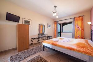 Postel nebo postele na pokoji v ubytování Hotel Erodios