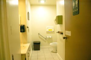 a bathroom with a toilet and a sink at Little Tokyo Hotel in Los Angeles