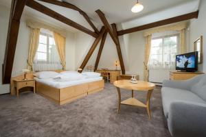 Postel nebo postele na pokoji v ubytování Hotel Zlaty Lev