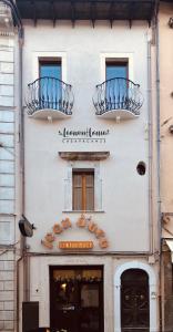 a building with two balconies on the side of it at LeonessHouse in Leonessa