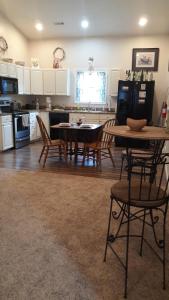 a kitchen with a table and chairs in a room at The Barrel House Bed & Breakfast in Loretto
