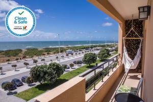 a view of the ocean from a balcony of a hotel at Mostarda Boutique Apartment in Vila do Conde