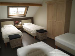 Tempat tidur dalam kamar di De Jölenberg