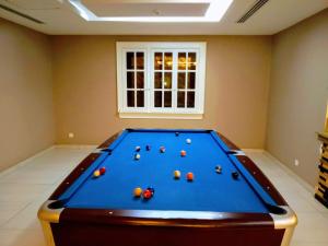 a billiard room with a blue pool table at شقق درر رامه للشقق المخدومة 6 in Riyadh