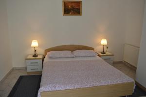 Posteľ alebo postele v izbe v ubytovaní Rooms & Apartments Kvasić