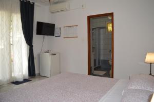 Posteľ alebo postele v izbe v ubytovaní Rooms & Apartments Kvasić