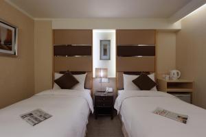 Postel nebo postele na pokoji v ubytování K Hotel Keelung + 36 fotografií