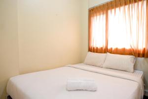 Postel nebo postele na pokoji v ubytování RedDoorz near Universitas Diponegoro Semarang 2