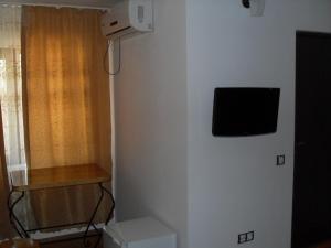 Телевизор и/или развлекательный центр в Pensiunea Pluto Sulina +30 фотографий