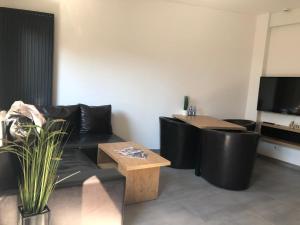 Telewizja i/lub zestaw kina domowego w obiekcie Apartamenty Dworcowa 45