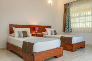 Voodi või voodid majutusasutuse Captain's Villa toas