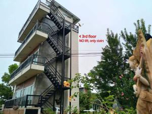 a sign on the side of a building with a fire escape at KHAO KHO SKY WINDS in Khao Kho