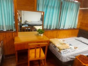 Voodi või voodid majutusasutuse Formosa Backpackers Hostel & Apartment（青年民宿） toas