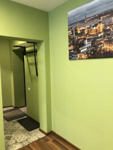 a hallway with a painting hanging on a wall at Green and quiet city center in Rīga