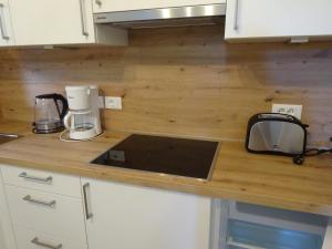 a kitchen with a counter top with a coffee maker at Garni Sonnleiten in Tirolo