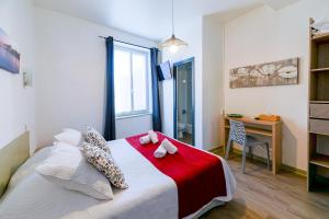 Un ou plusieurs lits dans un hébergement de l'établissement Hotel Cote Basque