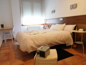 Posteľ alebo postele v izbe v ubytovaní Hotel Cuéntame
