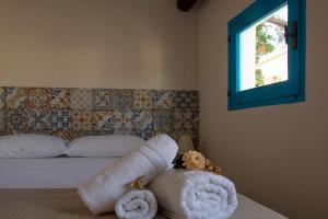 Säng eller sängar i ett rum på La Locanda degli Agrumi
