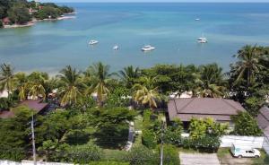 an aerial view of boats in the water with palm trees at Samui Garden Home - SHA Extra Plus in Lamai