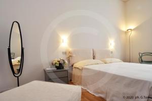 Postel nebo postele na pokoji v ubytování A.A.A. Armonie B&B