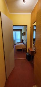 Postel nebo postele na pokoji v ubytování Hotel Poprad