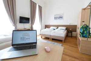 Posteľ alebo postele v izbe v ubytovaní Domus Peregrini Apartmanok
