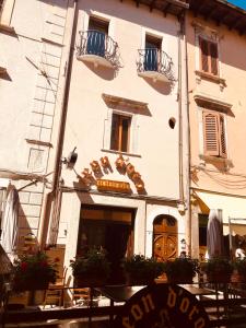 a building with a sign in front of it at LeonessHouse in Leonessa