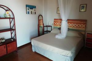 Ένα ή περισσότερα κρεβάτια σε δωμάτιο στο La casa di Ale