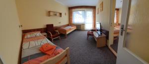 Postel nebo postele na pokoji v ubytování Hotel Poprad