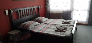 Postel nebo postele na pokoji v ubytování Hotel Poprad