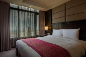 Postel nebo postele na pokoji v ubytování Arsma Hotel