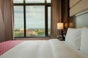 Postel nebo postele na pokoji v ubytování Arsma Hotel