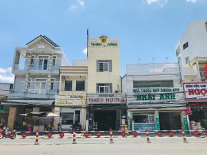 a group of buildings on a city street at OYO 1148 Thien Huong Hotel in Can Tho