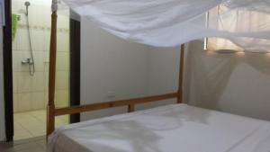 Letto o letti in una camera di Highway Motel