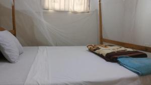 Letto o letti in una camera di Highway Motel