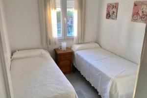 Posteľ alebo postele v izbe v ubytovaní Precioso apartamento muy cerca de la playa + 12 fotografií