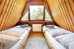 Ein Bett oder Betten in einem Zimmer der Unterkunft Das DÜNENHAUS