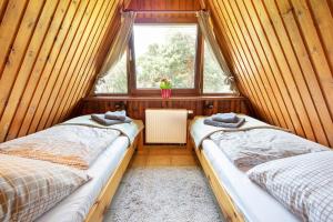 Postel nebo postele na pokoji v ubytování Das DÜNENHAUS