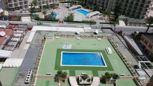 an overhead view of a tennis court in a city at Paraiso XI 1 Alquilevante in Benidorm