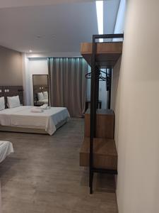 Llit o llits en una habitació de Sette Suites & Rooms - Adults Only