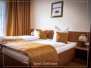 Postel nebo postele na pokoji v ubytování Hotel Kollerhof