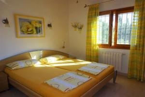 Postel nebo postele na pokoji v ubytování Villa Aurora + 10 fotografií