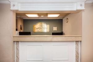 a lobby of a hotel with a reception counter at La Quinta by Wyndham Melbourne Viera in Melbourne