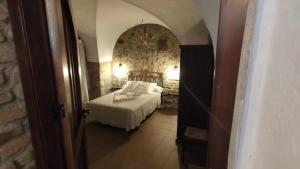 Postel nebo postele na pokoji v ubytování Apartamentos Rurales La Casa de Luis