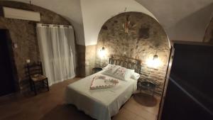 Postel nebo postele na pokoji v ubytování Apartamentos Rurales La Casa de Luis