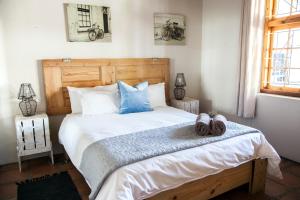Säng eller sängar i ett rum på Bergsicht Country Cottages - Town
