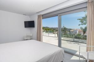 Posteľ alebo postele v izbe v ubytovaní Graham Holiday Rentals - Les Bassetes + 34 fotografií